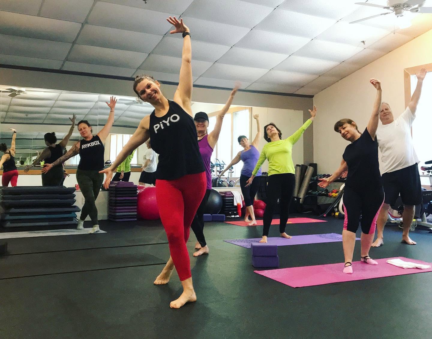 A full large-group class moving together at LAVA 24 Fitness